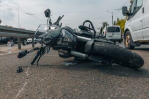 A crashed motorcycle on the road.