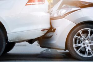Two white cars in a minor rear-end accident. What to do after a minor car accident.